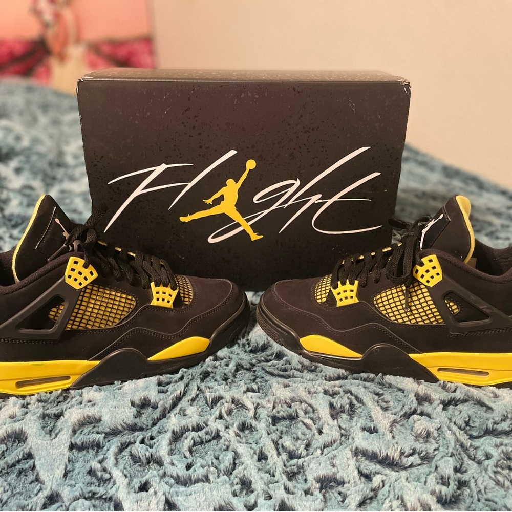 Air Jordan 4 Retro Sneakers in Black and Yellow